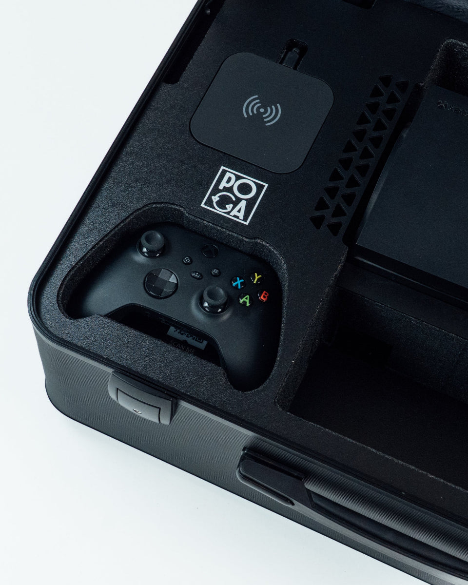 Close-up of a black electronic device with a controller and wireless connection symbol on a light gray background